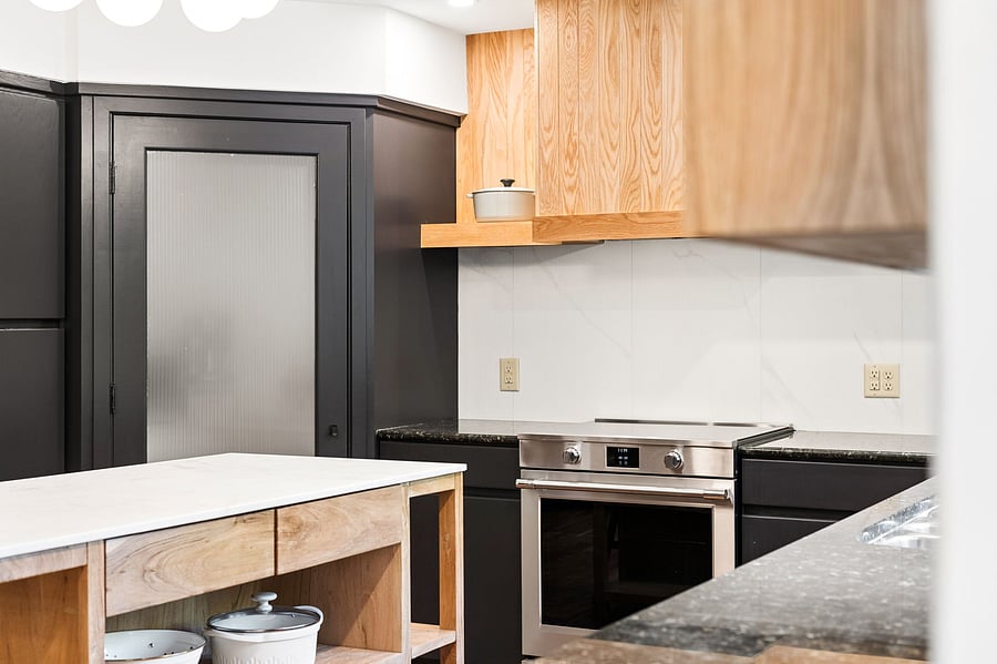 New stainless steel appliances include an induction range with vent-a-hood. Cook like a pro from day one with included cookware, bakeware, professional kitchen knives + cutting boards, and more.