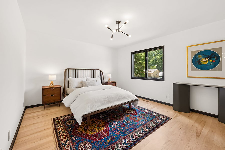 The large primary suite on the upper floor features refinished maple flooring, brand-new memory foam mattress and premium linens. Large ensuite walk-in closet and private primary bathroom with luxury finishes.
