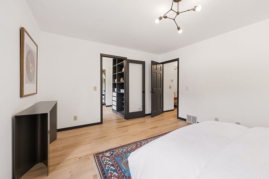 The large primary suite on the upper floor includes a ;arge ensuite walk-in closet and private primary bathroom with luxury finishes.