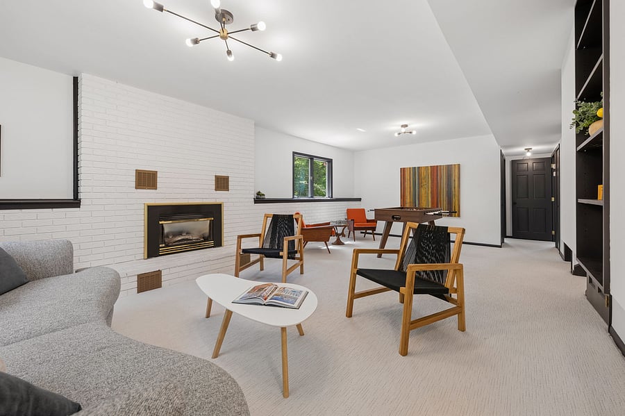 The large family room with gas fireplace is the home's natural family fun gathering spot. Relax with friends, play a board game, or challenge the family to a foosball tournament or a game of chess.