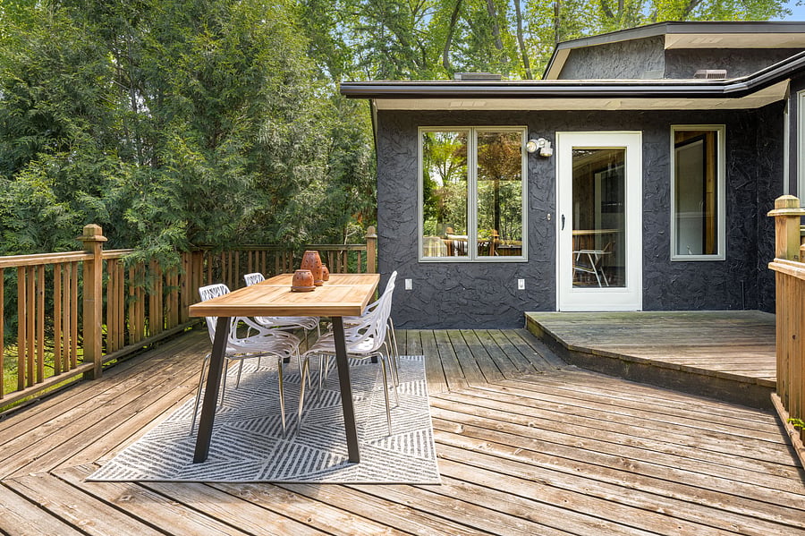 The back deck connects directly to the sunroom and leads out to the backyard.