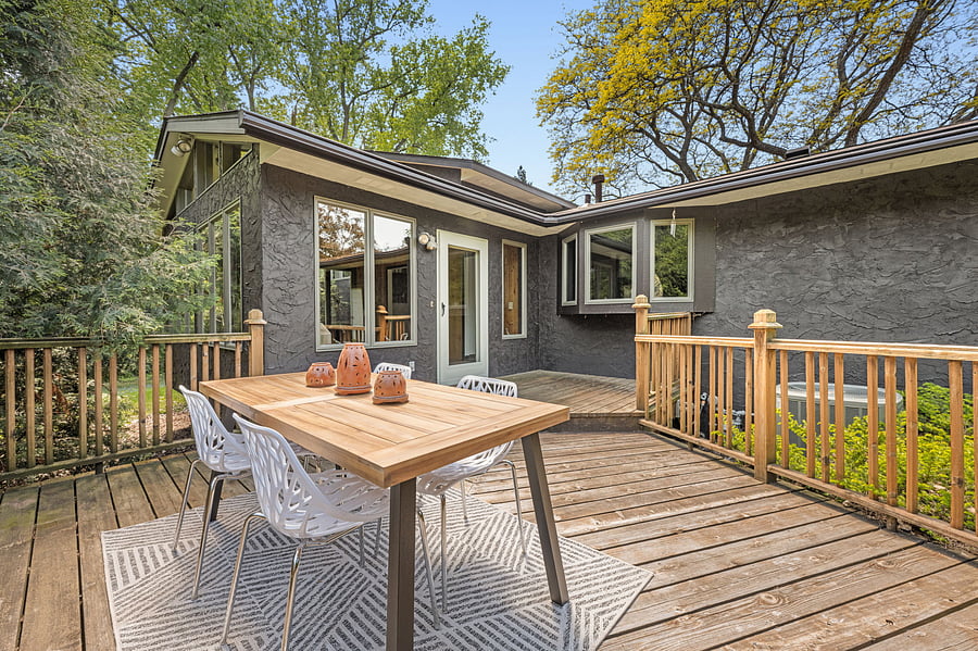 Plenty of room for entertaining and fun outdoors! The kitchen window looks out onto the back deck. The deck connects directly to the sunroom and leads out to the backyard.