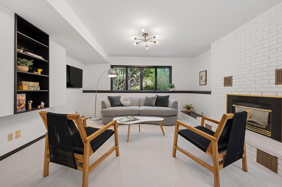The large family room with custom built-ins and a gas fireplace is the home's natural family fun gathering spot. Relax with friends, play a board game, or watch a movie with the wall-mounted 2026 Sony Bravia Smart TV.