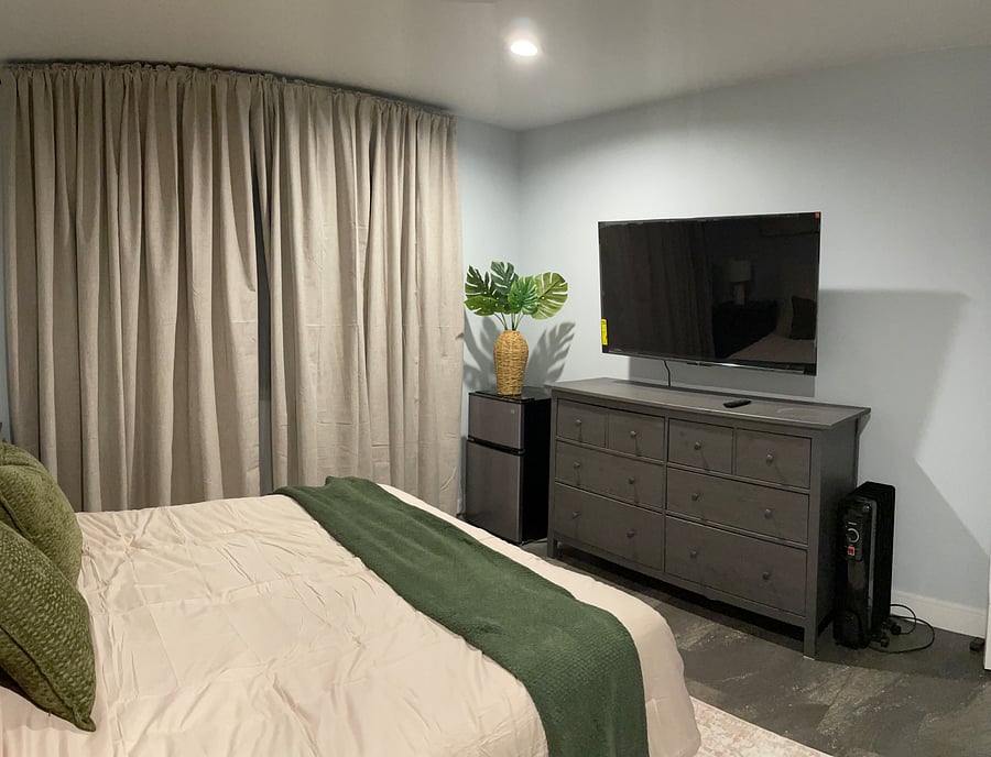 Relax and unwind with your own 55" smart TV and in-room mini fridge
