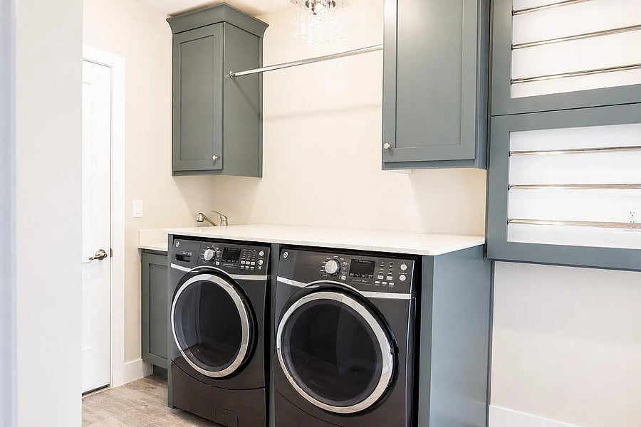 Oversized washer and dryer, drying racks and sink basin.
