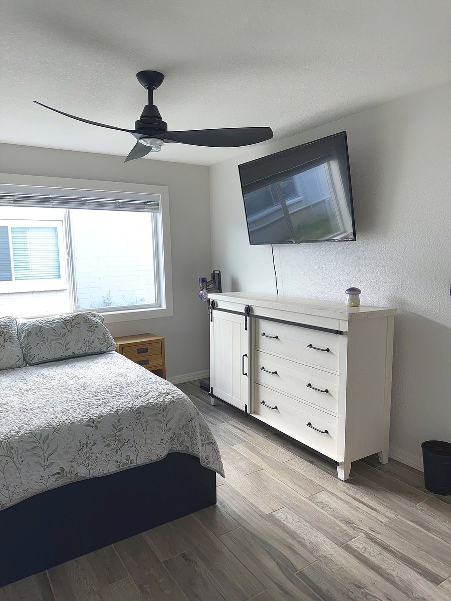 Bedroom with Smart TV and dresser