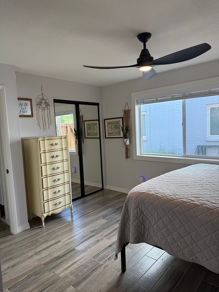 Bedroom with dresser and mirrored closet