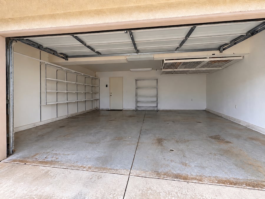 2 car garage with storage shelves and remote control