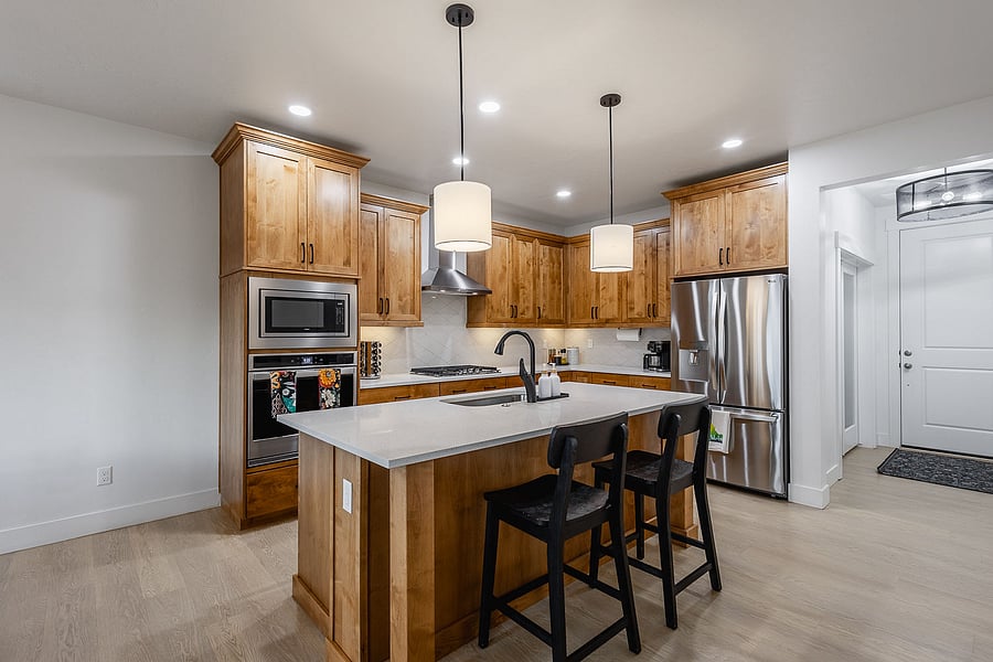 Fully stocked kitchen, air fryer, Kruig coffee maker, gas range, stainless steel appliances, and quartz countertops.