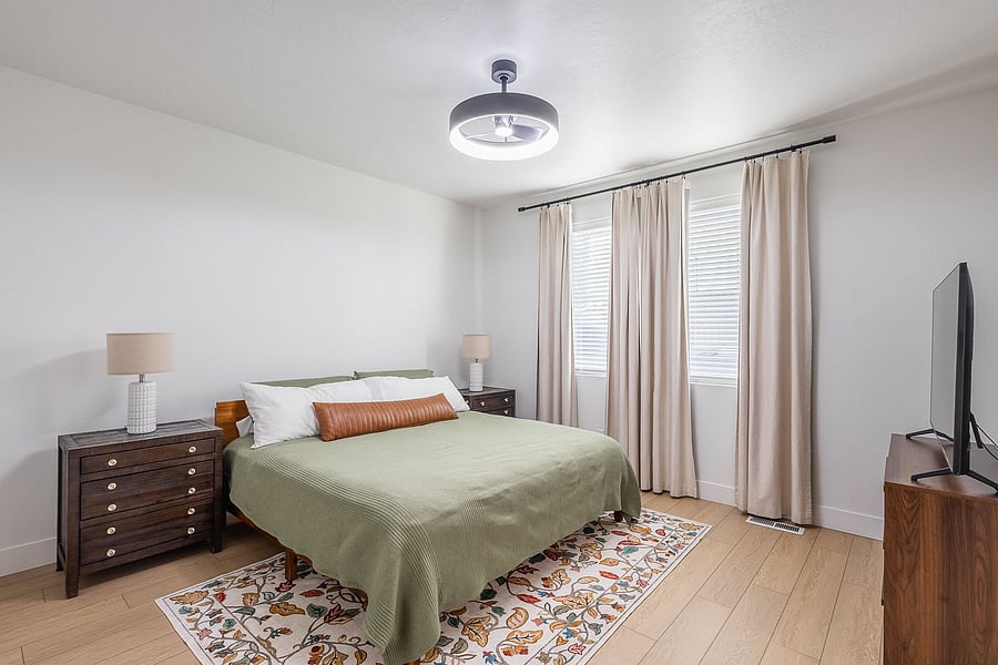 King sized bed, ceiling fans, blackout curtains, Smart TV, en suite bathroom, dressers, and walk in closet.