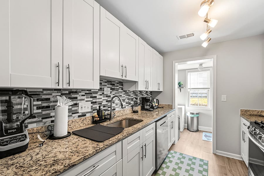 Enjoy a coffee, tea, and hot drink bar w/ a drip coffee maker, French press, and water kettle, plus essentials for cooking including new knife set and cutting boards and new appliances like air fryer, blender, microwave, toaster, and dishwasher.