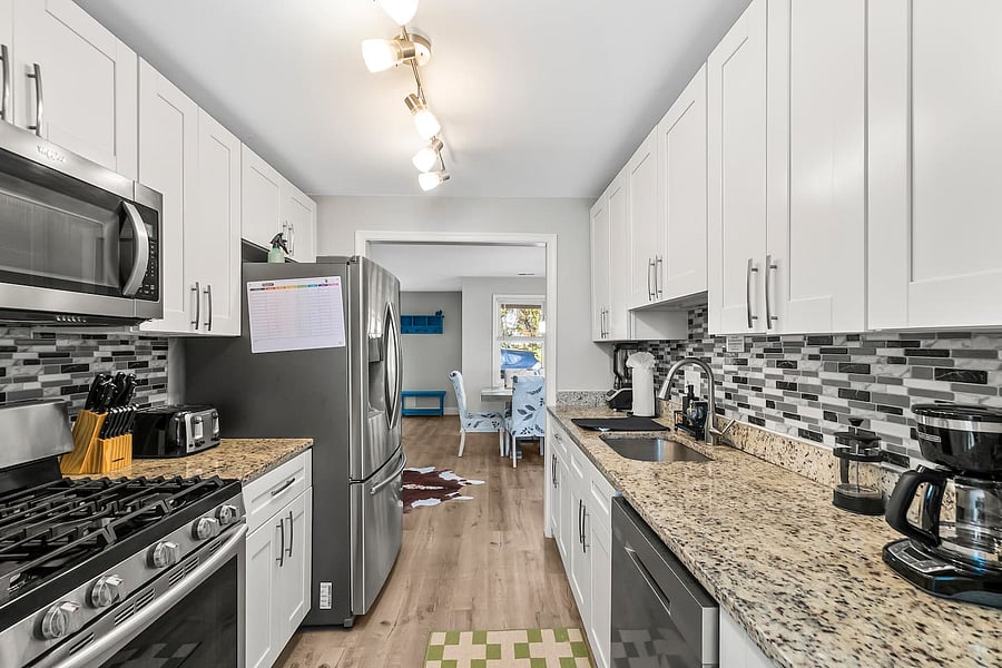 Brew, chop, cook! Coffee/tea bar, French press, drip coffee maker, kettle, new appliances, knife set, and cutting boards.