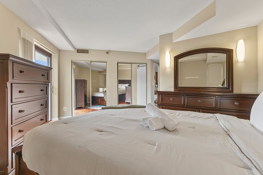 Bedroom 2 with mirrored closets and generous storage for longer stays