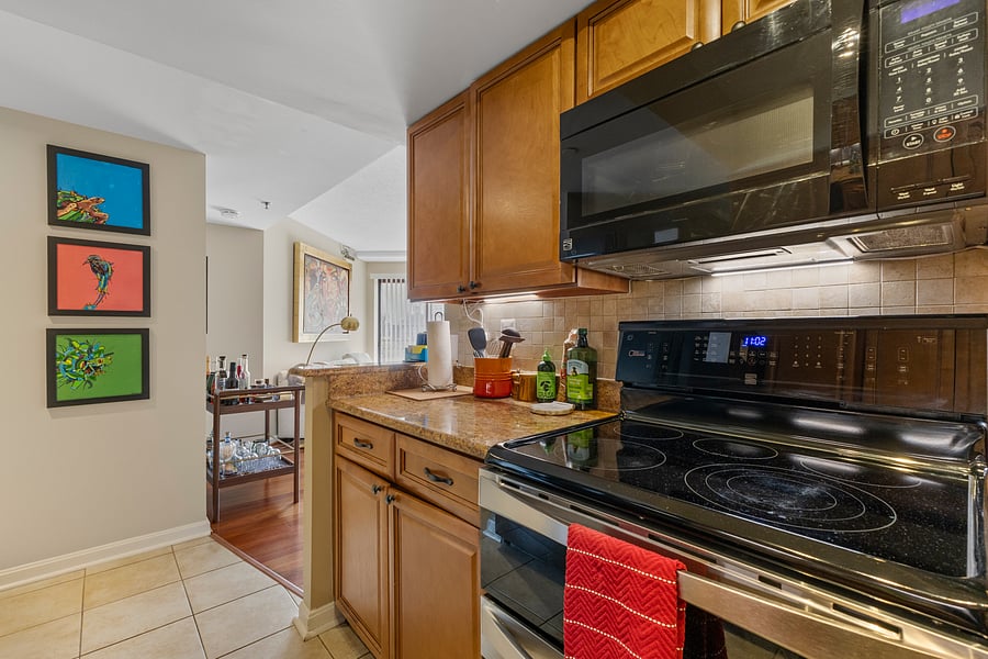 Fully equipped kitchen with granite countertops and stainless steel appliances