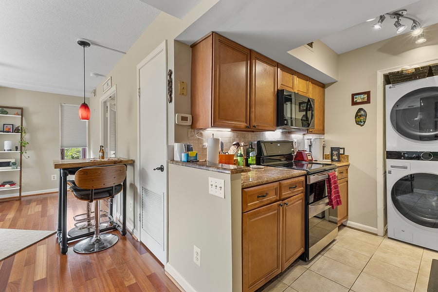 Kitchen with breakfast bar seating and cooking essentials