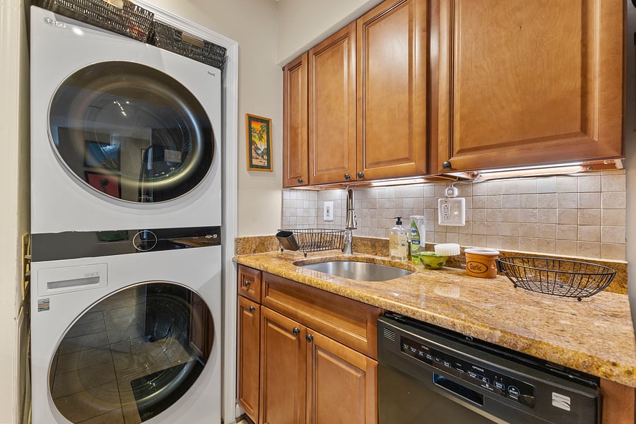 In-unit washer and dryer next to the kitchen