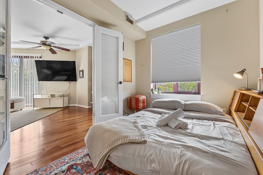 Bedroom 1 with French doors and a cozy double bed