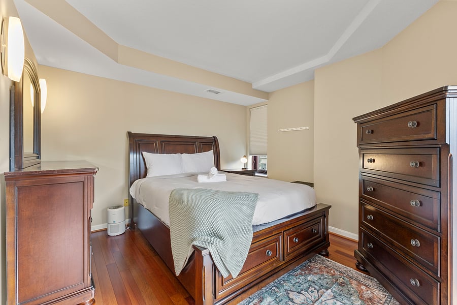 Bedroom 2 with a plush queen bed and premium linens