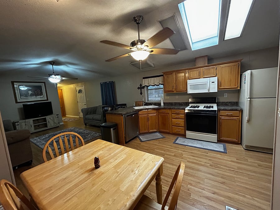 Dining area, kitchen, and living room.