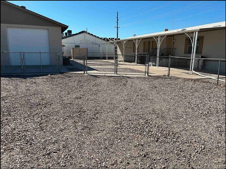 Parking area outside the gates. You are welcome to park inside or outside the gates if you would like.
The shop to the left is not part of the rental.