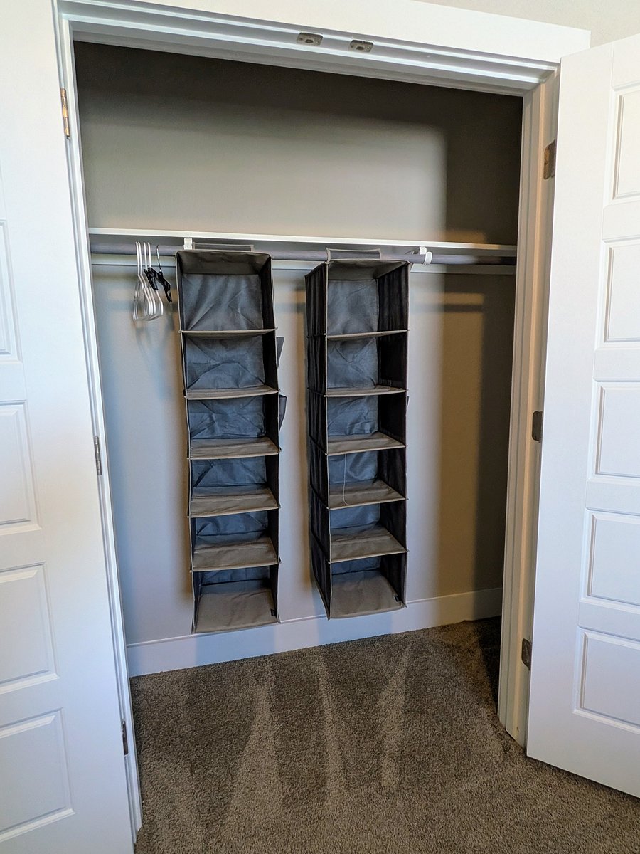 Hanging storage shelves in secondary bedroom closet