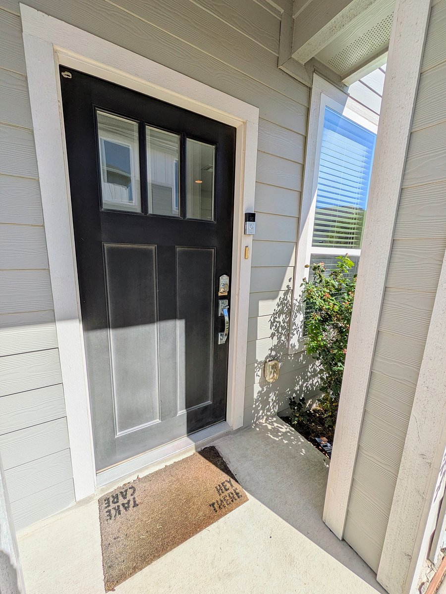 Covered entrance to townhome with keyless entry