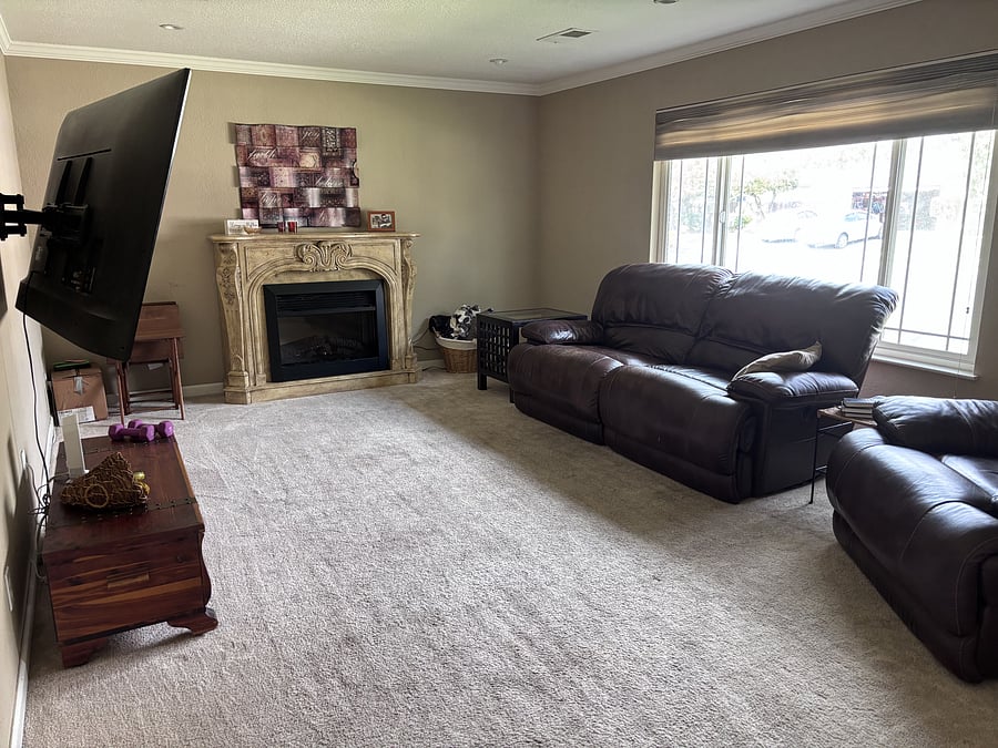 family room with electric fireplace, big screen LG TV, internet, and privacy door