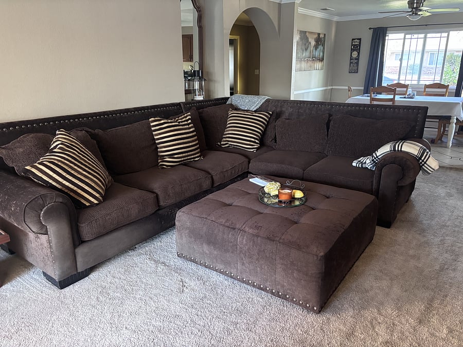 living room with sliding door to the back patio with pool