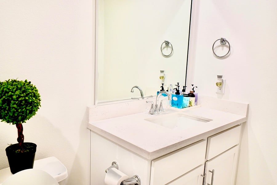 Private vanity with counter space for all your things.