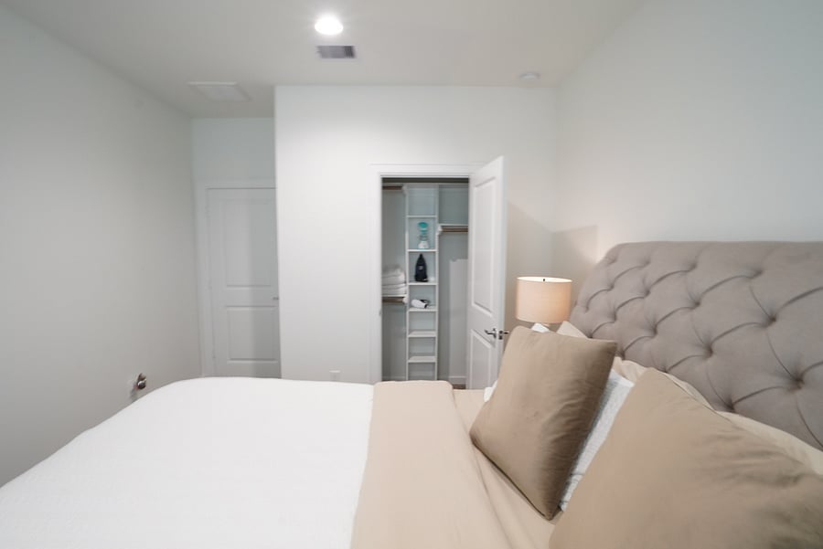 Tufted king headboard and closet storage, so you can fully unpack for a long contract.