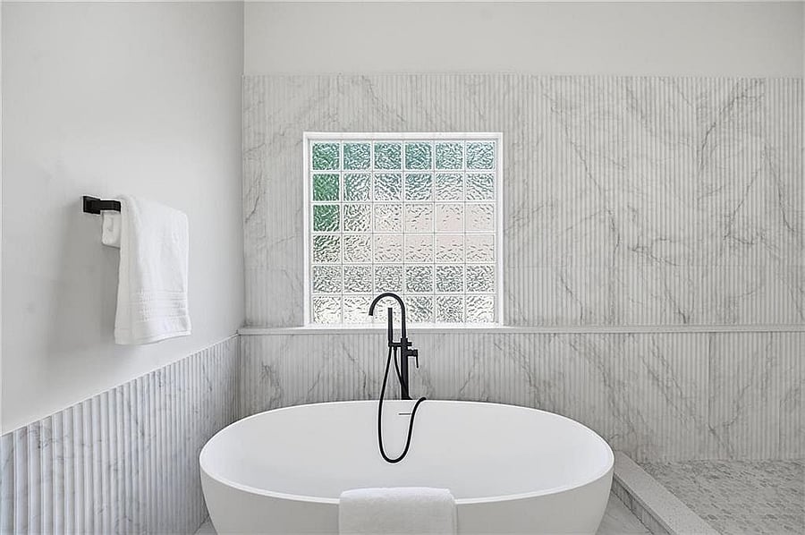 Freestanding soaking tub in the primary bath