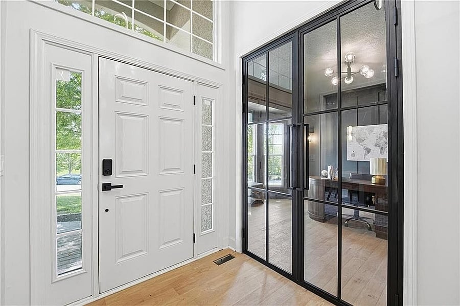 Private main-level office behind black-framed glass doors