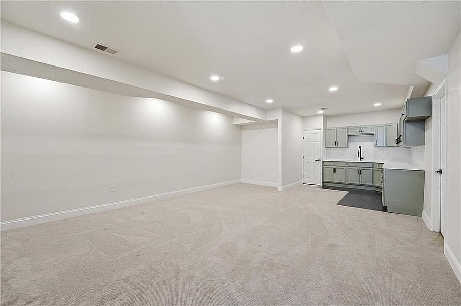 Lower-level recreation area with wet bar