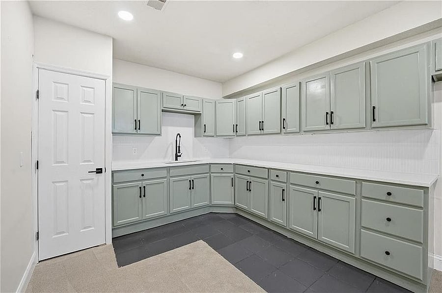 Wet bar with sink, counters and built-in cabinetry