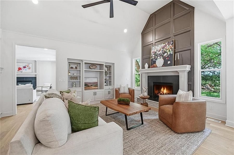 Great room fireplace flanked by custom built-ins