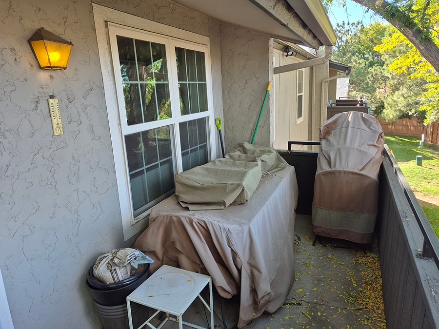 Tiled table with 4 chairs on back patio