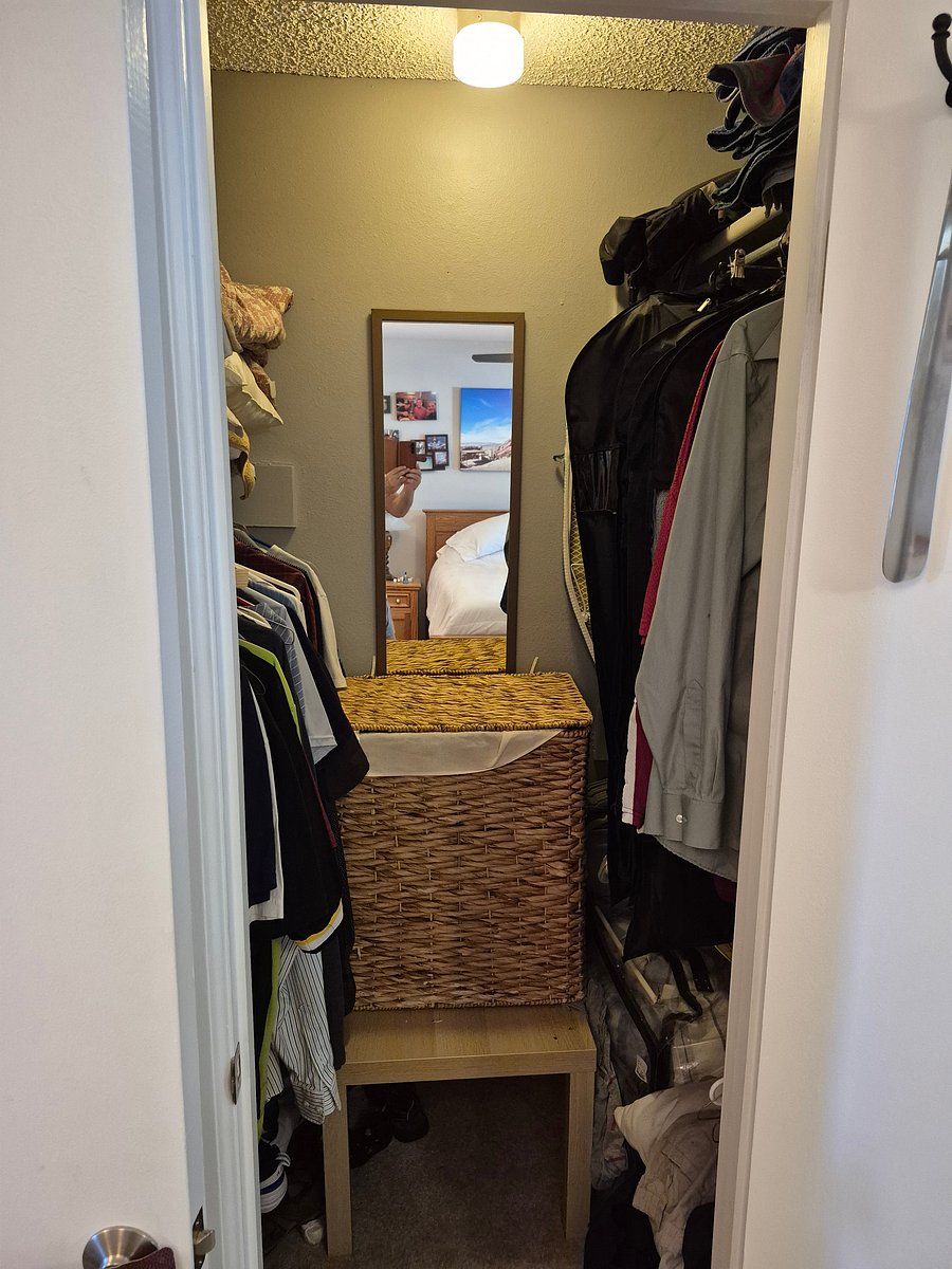 Walk in closet in master bedroom.