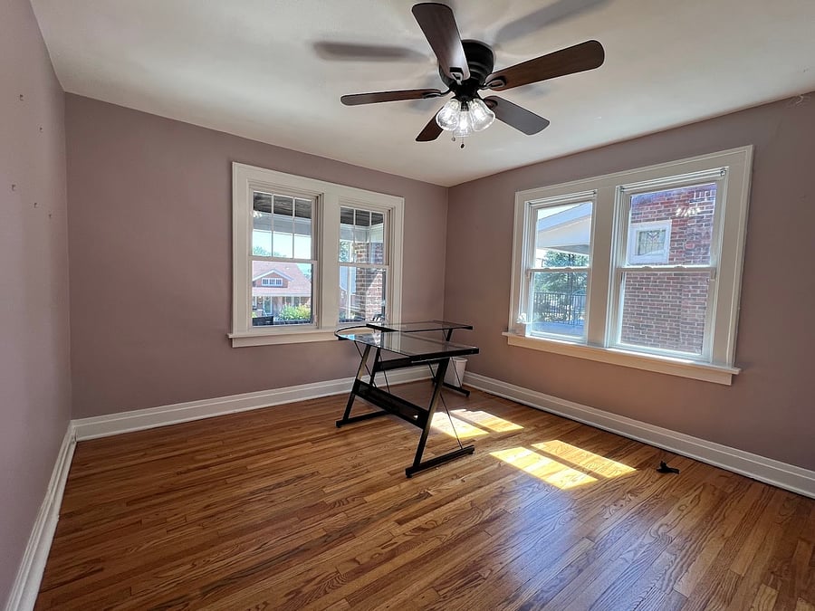 Second bedroom is a working space. Chair and floor mat included. Great view from your chair looking out over the pretty street with other bungalow homes and trees.