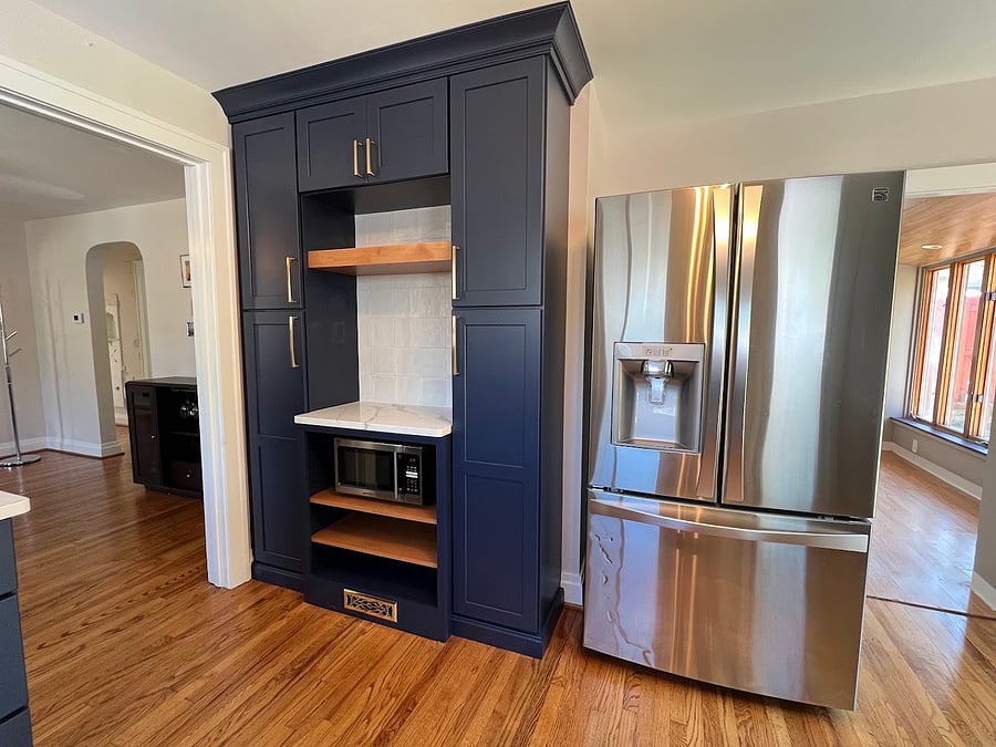 Kitchen renovated in 2024 with new cabinets, countertops, stove, and dishwasher. Full size refrigerator. Beautiful wood floors are original to the house.