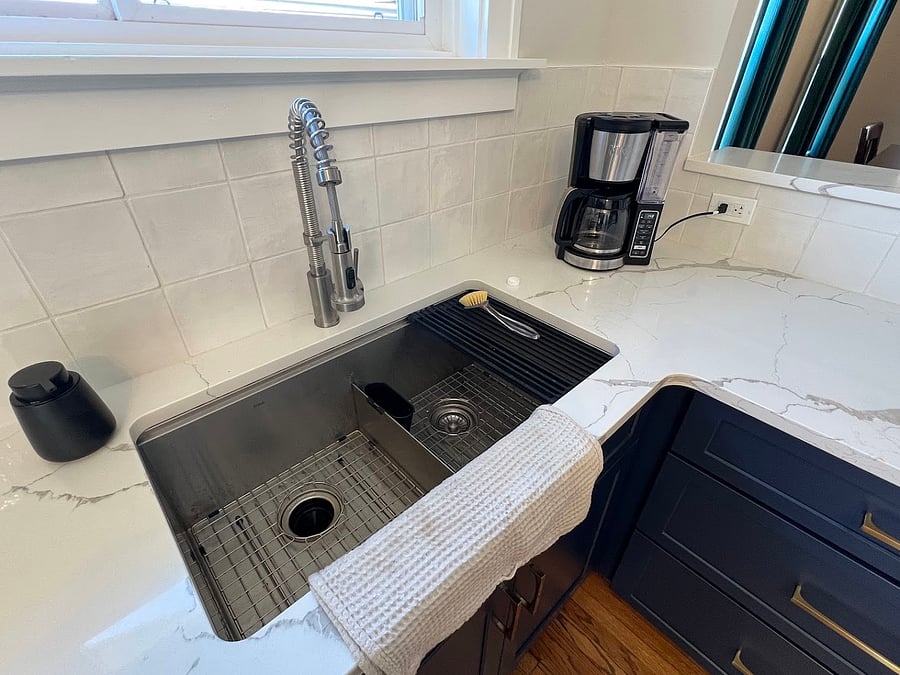 Kitchen renovated in 2024 with new cabinets, countertops, stove, and dishwasher. The sink is spacious and functional, comes with a roll-out drying mat (see right size of sink). This sink was one of my (unexpected) favorite upgrades in 2024!