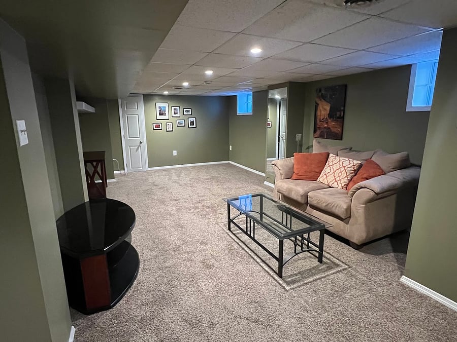 Basement also includes this finished, furnished space for relaxing. Can also be used for stretching and working out.