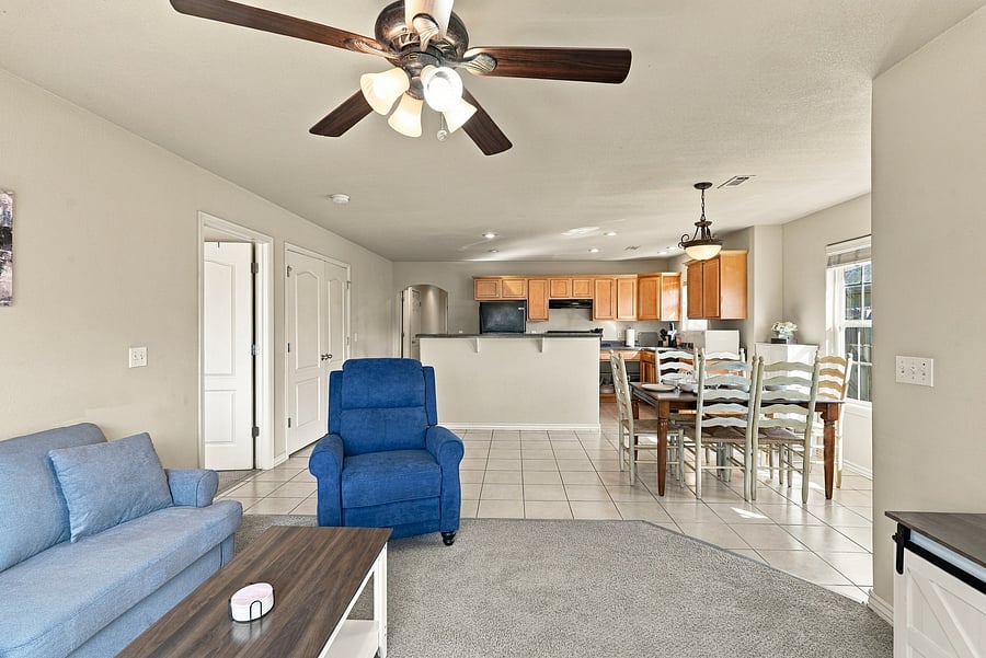 Open floor plan between kitchen, dining, and living rooms.