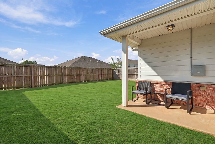 Sitting area in private, fenced back yard.