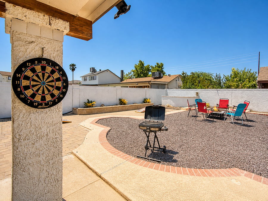 Unwind in the sun-drenched outdoor lounge area while dinner cooks on the charcoal grill.