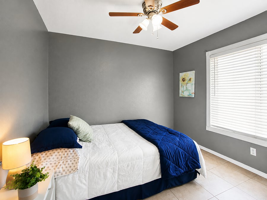 Wake up refreshed as bright, natural light filters through the adjustable window blinds.