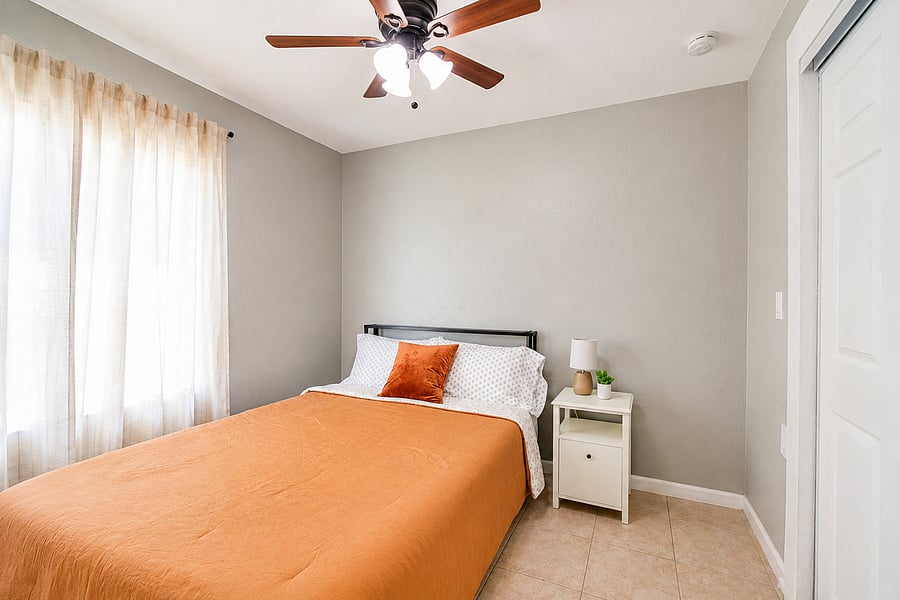 Experience a peaceful, climate-controlled night's sleep under a refreshing overhead fan.