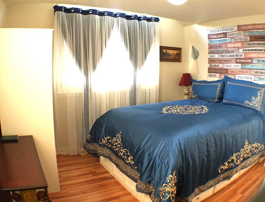 Queen bed room with ensuite bath and sitting area on 2nd floor.