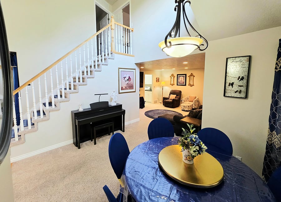 Open concept dining room connected to living area on main floor.