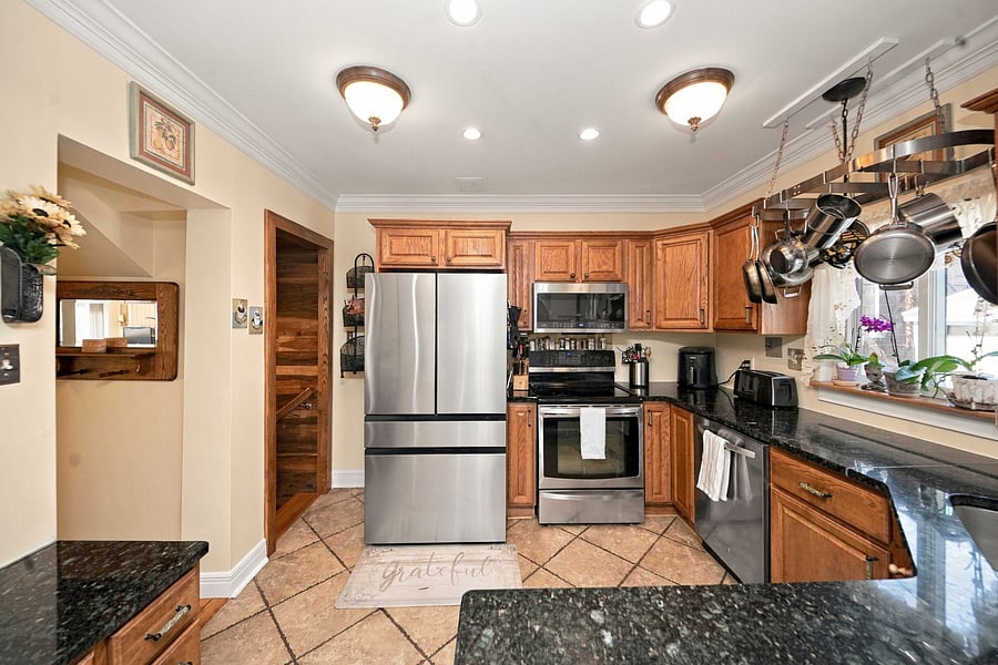 Fully stocked kitchen with all stainless steel appliances.