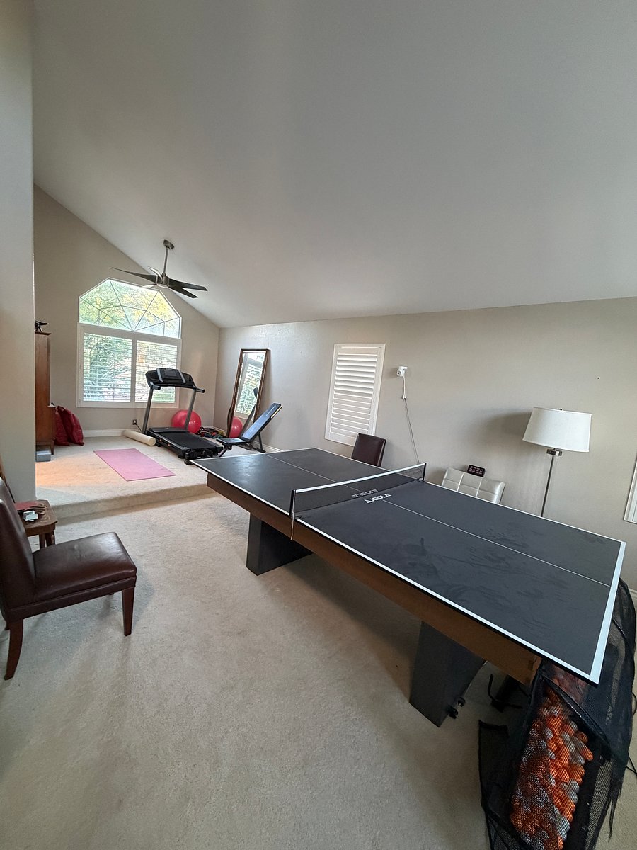 Game room and treadmill and work out bench